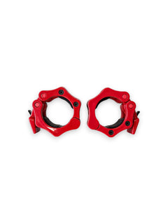 A pair of Fitness Canada heavy-duty 2 inch Olympic plastic quick-release barbell collars with inner rubber grip pads shown in red, isolated on a white background as seen in image.