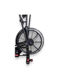Close-up view of the Fitness Canada air bike large front steel fan wheel.