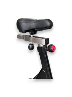 Side angle view of the black Fitness Canada air bike padded adjustable seat.