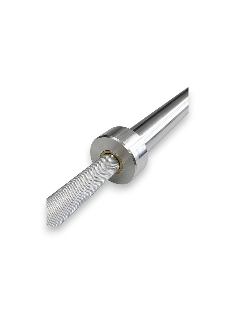 Premium 7ft high-strength alloy stainless steel Apex Series Competition Barbell from Fitness Canada featuring volcanic knurled shaft grip rings and dual hard chrome Olympic sleeves, isolated on a white background as seen in Image.
