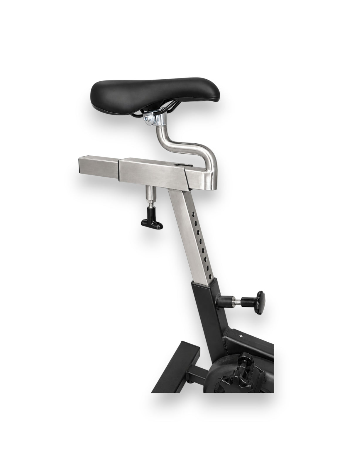 Close up view of the black Fitness Canada Cycling Spin Bike featuring adjustable chrome seat post, seat saddle, and two way adjustable knobs for horizontal and vertical positioning