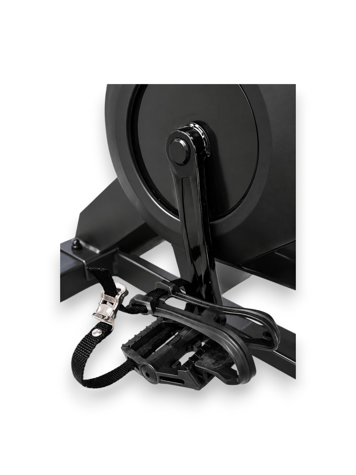 Close up view of the black Fitness Canada Cycling Spin Bike featuring toe-cage pedals with adjustable strap