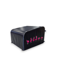 Angled view of the Fitness Canada black vinyl padded hip thrust and step up box on a gym floor, displaying pink instructional exercise icons on the side and heavy-duty steel D-ring resistance band anchors, as seen in image.