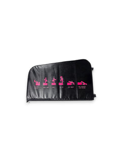 Side view of the Fitness Canada black vinyl padded hip thrust and step up box on a gym floor, displaying pink instructional exercise icons on the side and heavy-duty steel D-ring resistance band anchors, as seen in image.