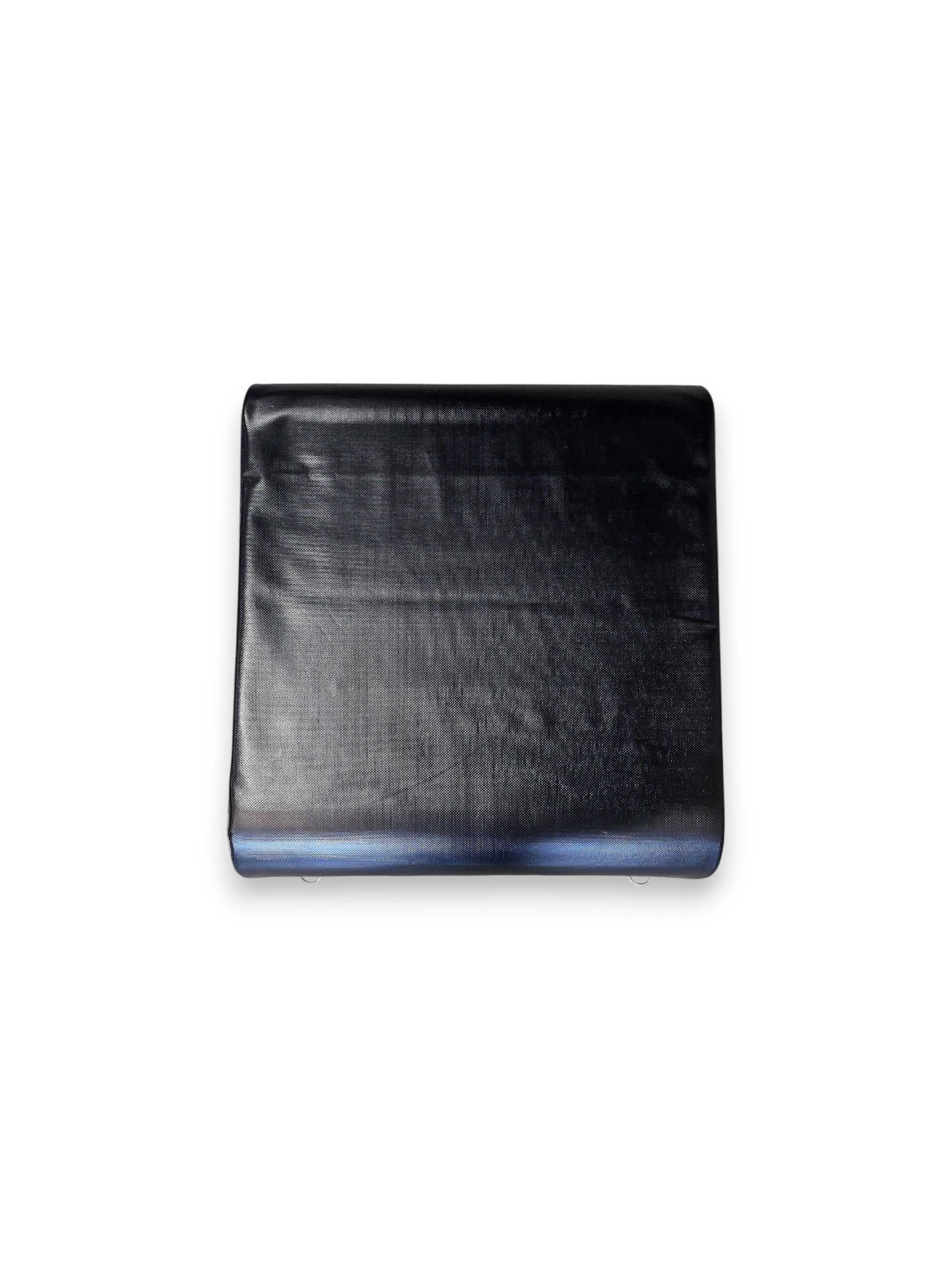 Top view of the Fitness Canada black vinyl padded hip thrust and step up box on a gym floor, displaying pink instructional exercise icons on the side and heavy-duty steel D-ring resistance band anchors, as seen in image.